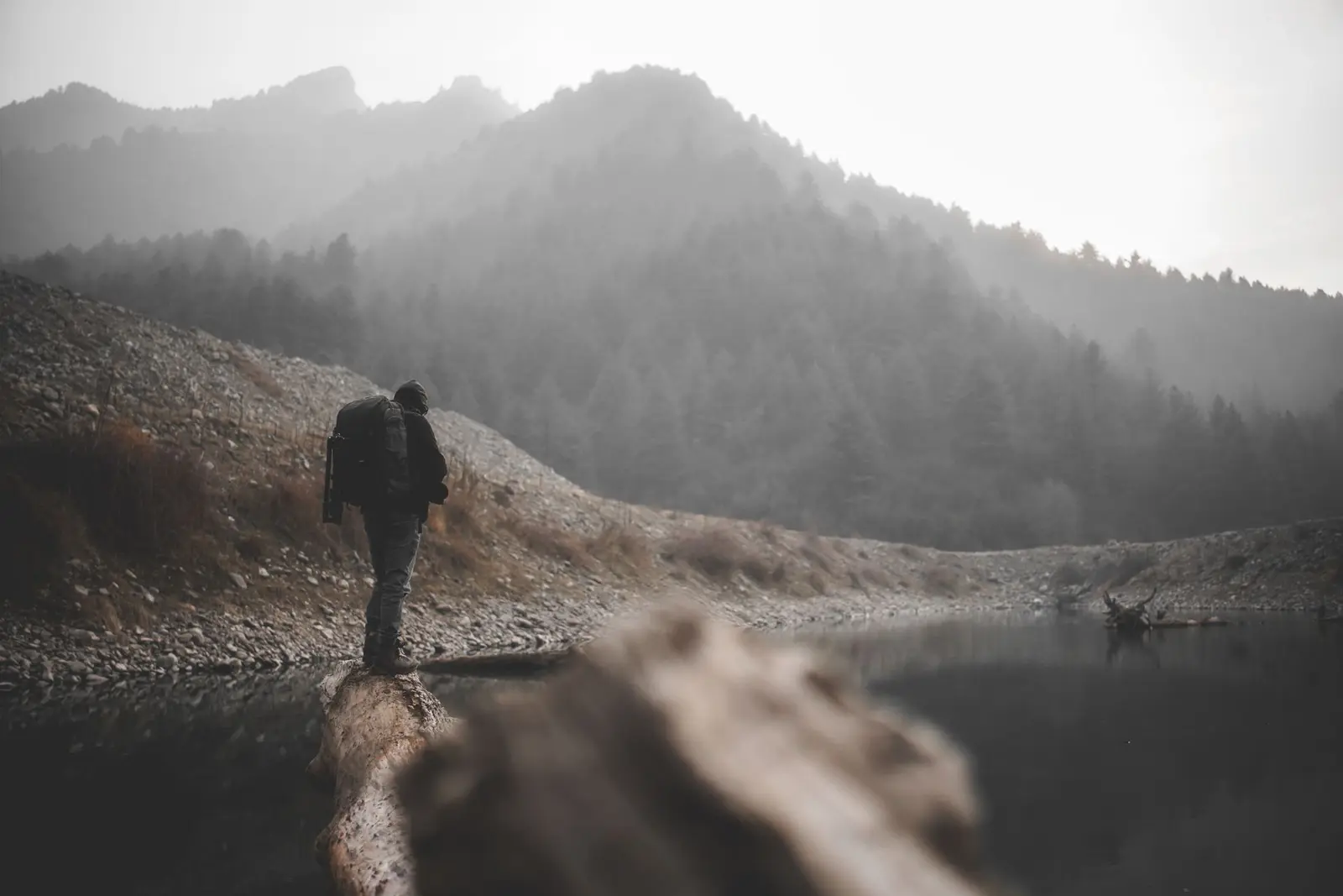 A man pausing on a quiet trail to think through his next move