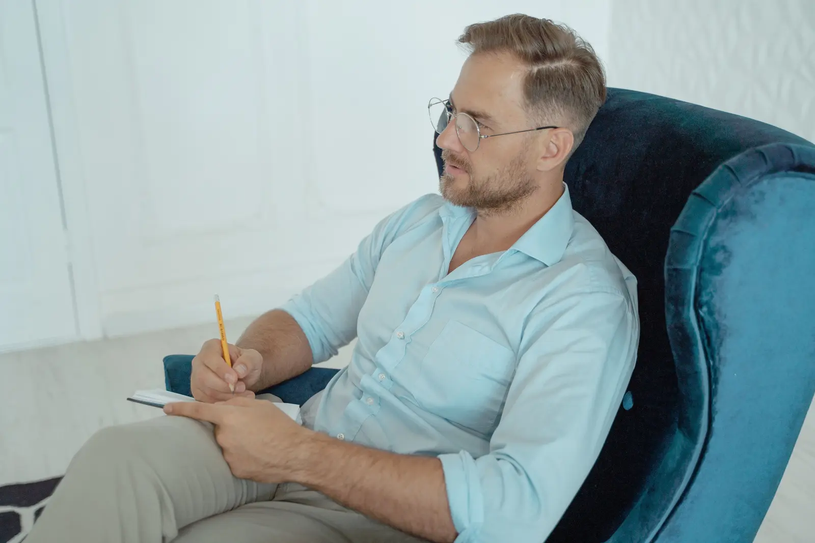 A man taking notes while planning his next steps