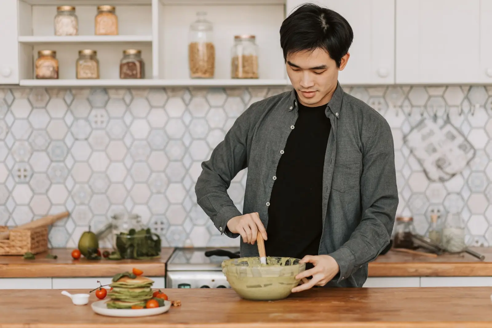 A man cooking a healthy meal in his kitchen