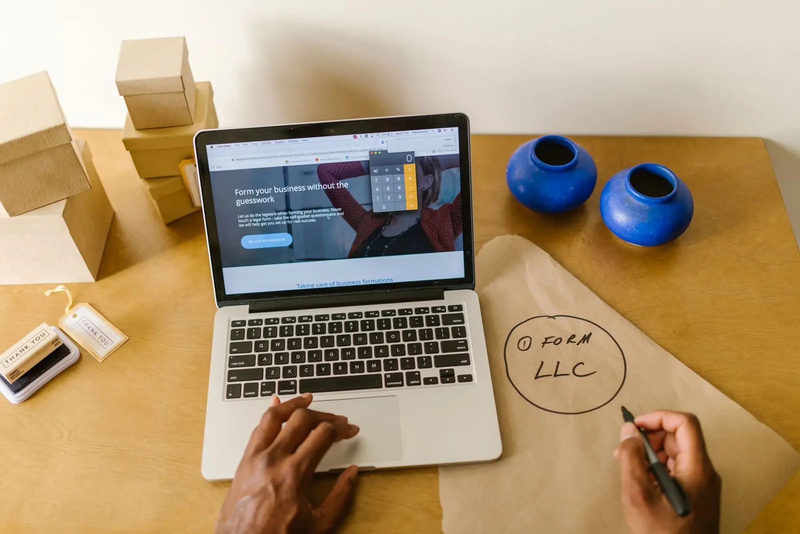 Small business owner setting up their business and marketing plan on a laptop