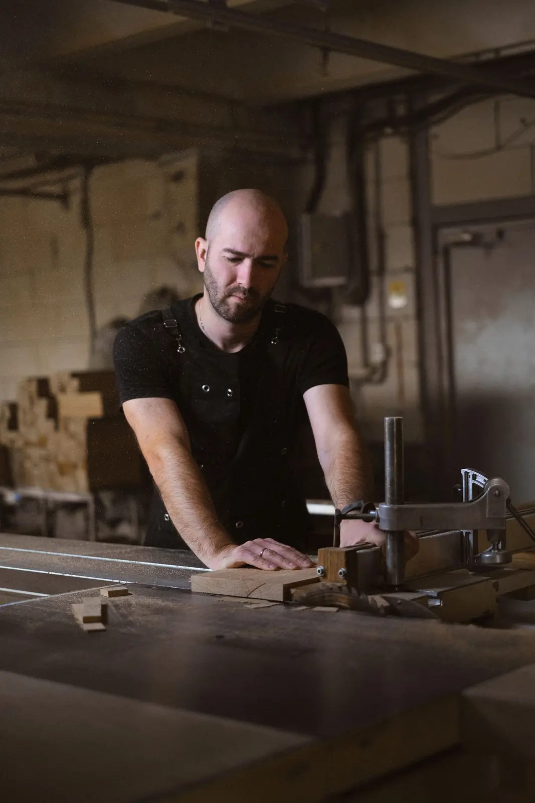 A craftsman working at his bench, building his product by hand