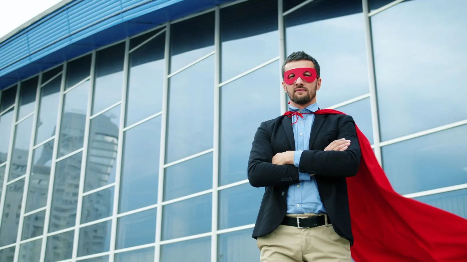 A businessman in a cape and mask, confident in his offer