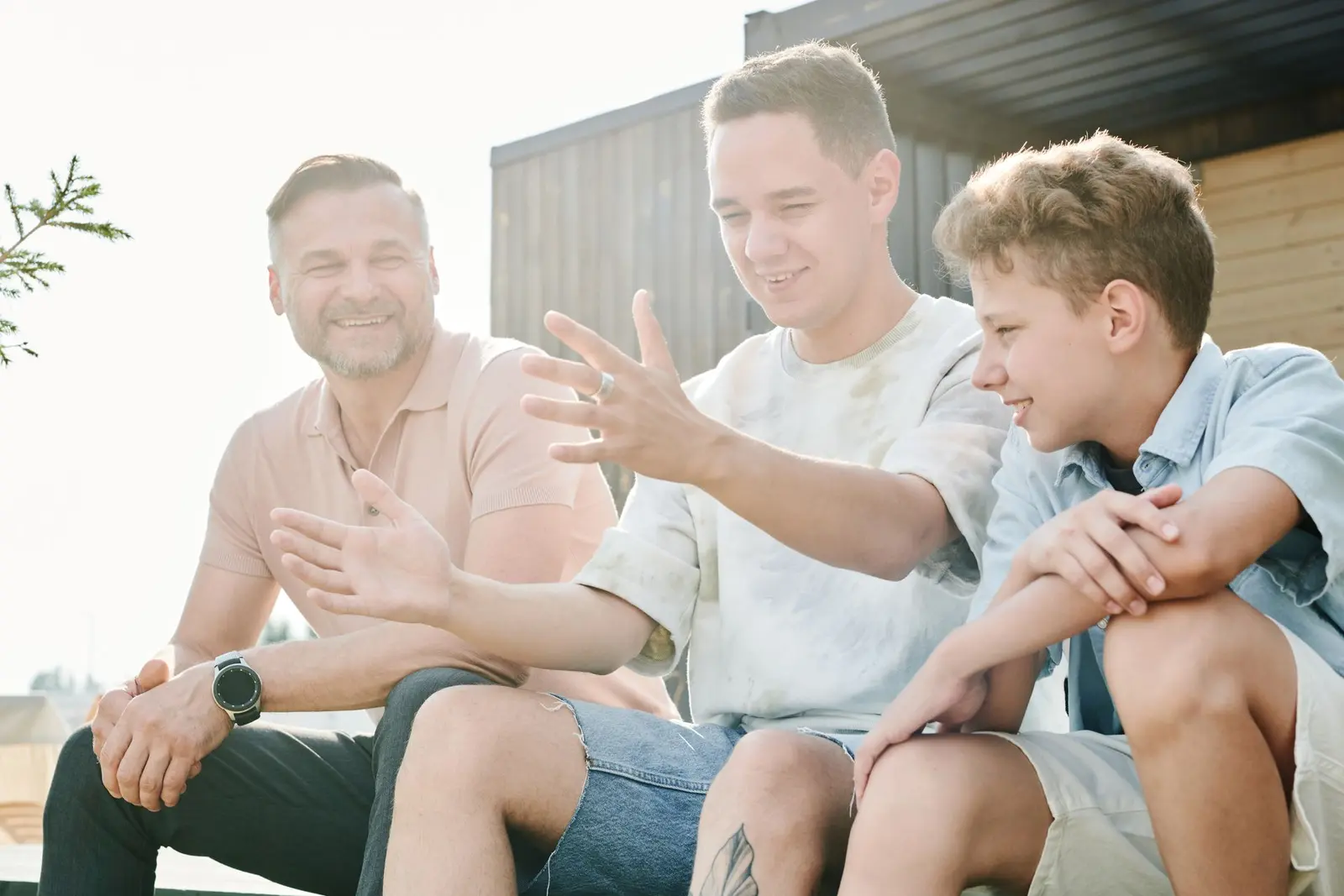 A father talking openly with his two sons