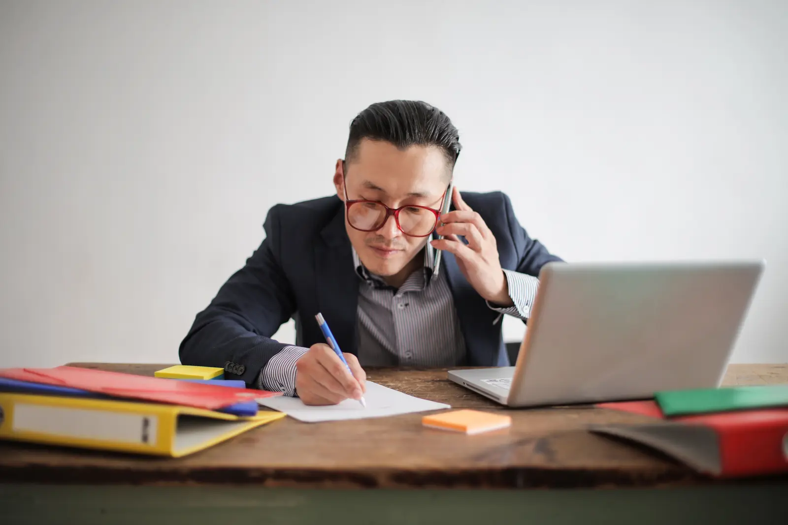 A business owner on a call with a client, following up on a lead