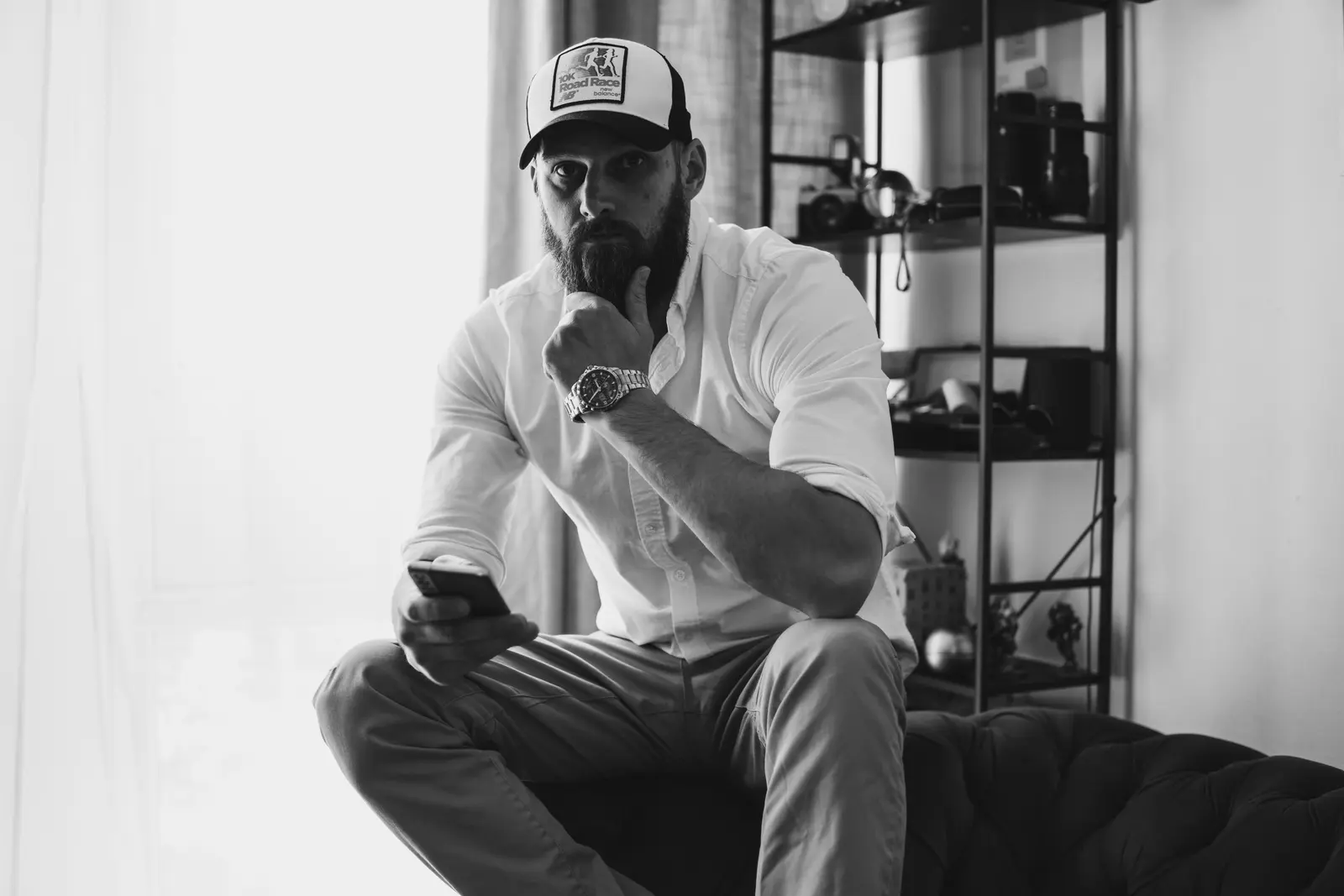 A man on his phone, thinking through a follow-up call
