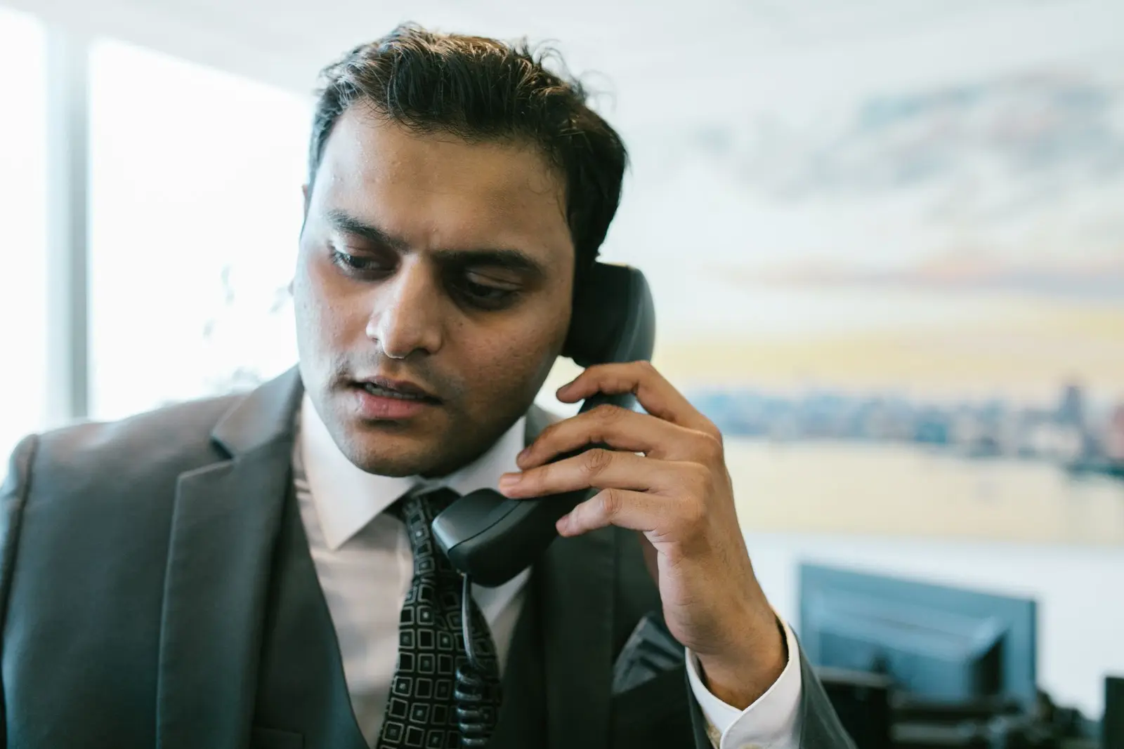 Man on a business phone call, following up with a client