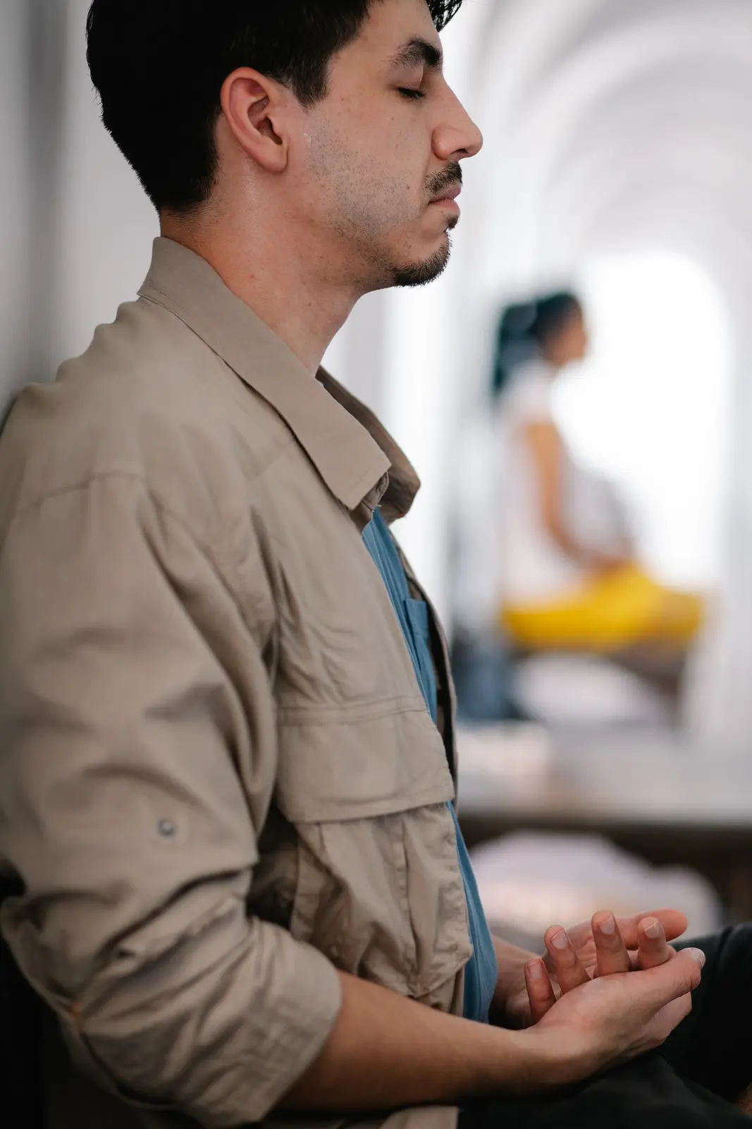 A man with his eyes closed, taking a moment to steady himself
